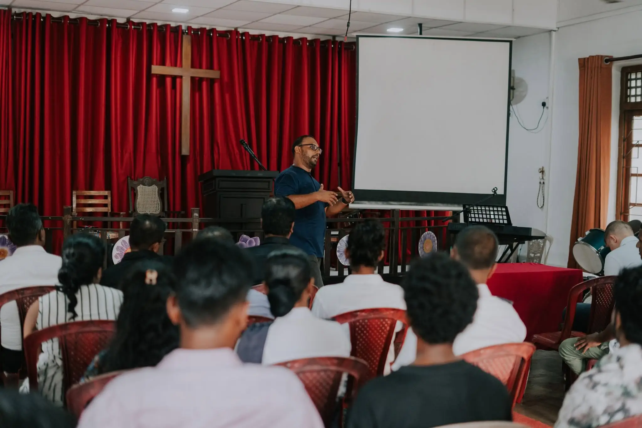 A congregation seated while someone teaches from the front
